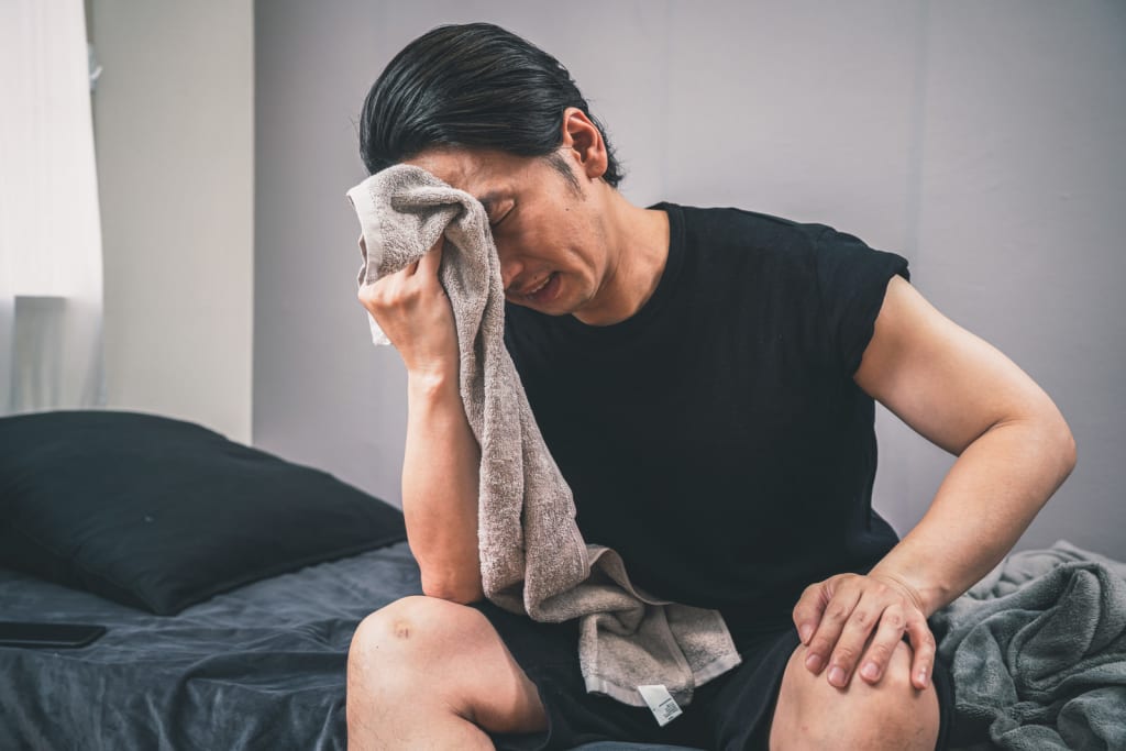 汗をかいた男性